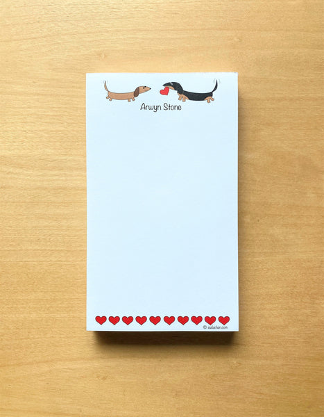 Two dachshunds with hearts personalized notepad.