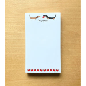 Small list notepad with two dachshunds facing each other with one holding a heart, 100 sheets, personalized notepad