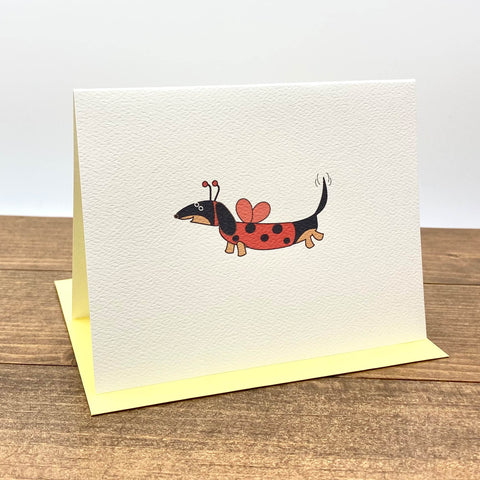 Black and tan dachshund dressed as ladybug note card.