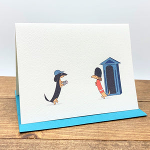 Dachshunds in London note cards featuring one dachshund dressed as tourist and the other as Queen's guard.
