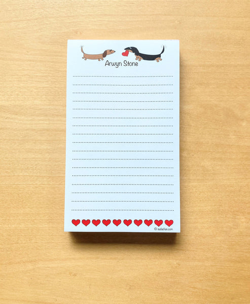 Two dachshunds with hearts personalized, lined notepad.