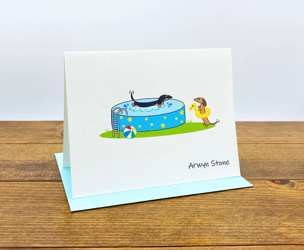 Dachshund pool party personalized cards.  One dachshund splashing in the pool and the other wearing a bright yellow swim floatie.
